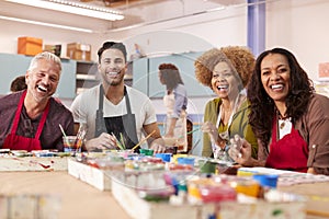 Portrait Of Mature Adults Attending Art Class In Community Centre