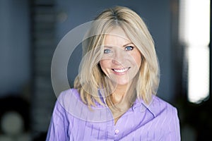 Portrait of a mature blond woman smiling