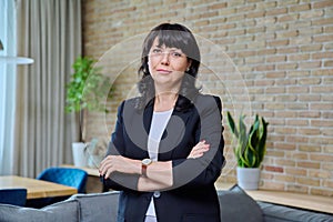 Portrait of mature business confident woman in office