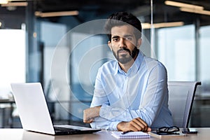 Portrait of mature businessman boss, man serious thinking looking at camera, businessman at workplace working inside