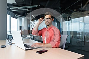 Portrait of mature businessman freelancer startup, bearded man smiling and looking at camera, business owner working