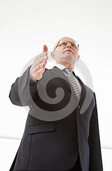 Portrait of a mature businessman offering handshake