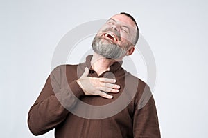 Portrait of a mature caucasian man with beard laughing