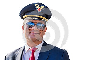 Portrait of mature confident pilot captain  wearing eyeglasses in airport