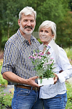 Portrait Of Mature Couple Shopping At Garden Center