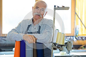 portrait mature diligent workman in workshop