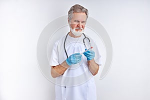 Portrait of mature doctor man with sampling tube of infected person corona virus in laboratory