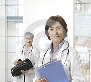 Portrait of mature female doctor at medical center