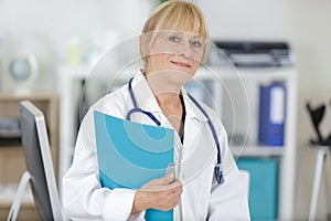 portrait mature female doctor standing