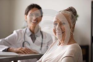 Portrait of mature female patient satisfied with clinic