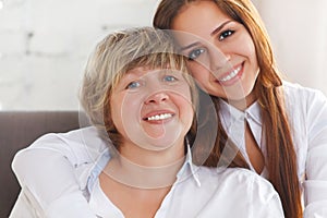 Portrait of a mature grandmother and teen granddaughter and teen