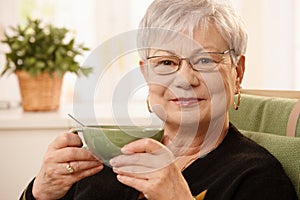Portrait of mature lady with teacup