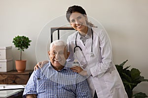 Portrait of mature male patient pose with female nurse
