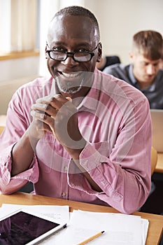 Portrait Of Mature Man Attending Adult Education Class