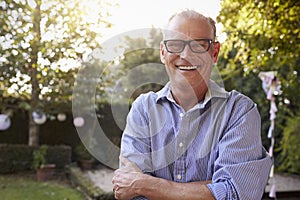 Portrait Of Mature Man In Back Yard Garden