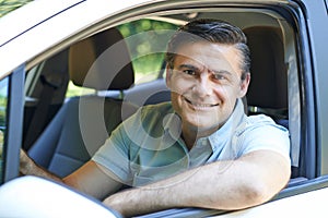 Portrait Of Mature Man Driving Car