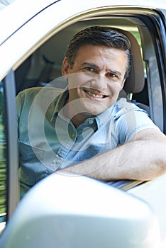 Portrait Of Mature Man Driving Car