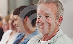 Portrait, mature man and family on sofa together for love, support and retirement visit on weekend break. Male person