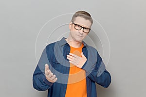 Portrait of mature man feeling respect and expressing gratitude