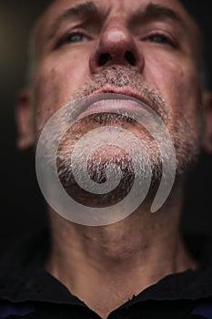 Portrait of a mature man with gray hair and beard