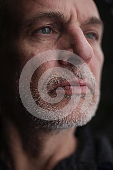 Portrait of a mature man with gray hair and beard