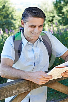 Portrait Of Mature Man Hiking In Countryside