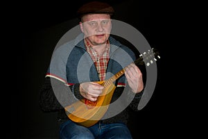 Portrait of mature man with mandolin