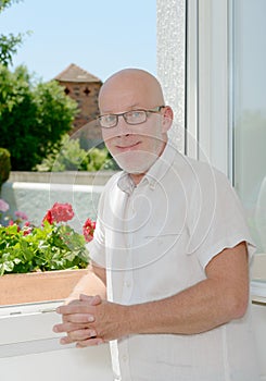 Portrait of a mature man near a window