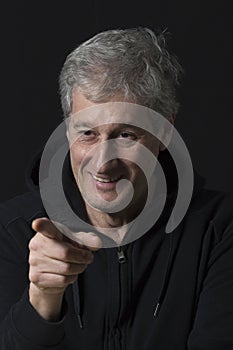 portrait of a mature man pointing his finger