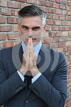 Portrait of mature man praying