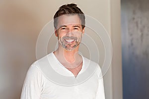 Portrait of a mature man smiling at the camera. So happy