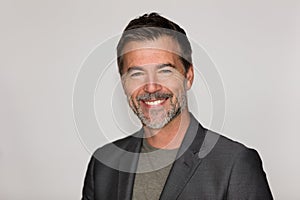 Portrait Of A Mature Man Smiling At The Camera. Isolated on white. Business.