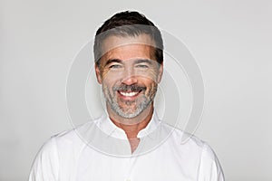 Portrait Of A Mature Man Smiling At The Camera. Isolated on white. Business.