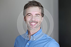 Portrait of a mature man smiling at the camera sitting