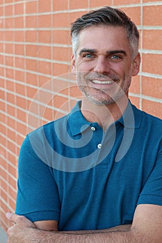 Portrait of a mature man smiling at the camera - Stock image
