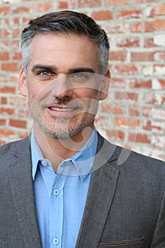 Portrait of a mature man smiling at the camera - Stock image