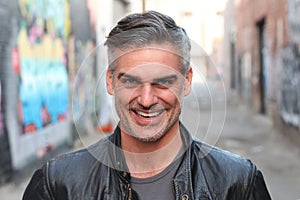 Portrait of a mature man smiling at the camera - Stock image