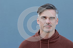 Portrait of a mature man smiling at the camera - Stock image with copy space