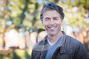 Portrait Of A Mature Man Smiling At The Park