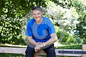Portrait Of Mature Man Using Activity Tracker Whilst Exercising