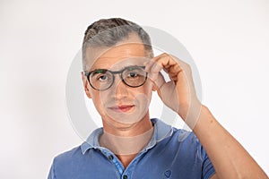 Portrait of mature man wearing eyeglasses looking at camera