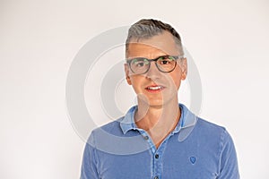 Portrait of mature man wearing eyeglasses smiling at camera