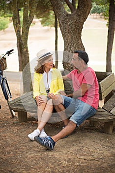 Portrait of mature man and woman dating in park