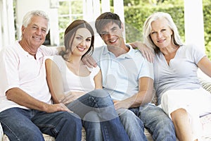 Portrait Of Mature Parents Relaxing With Grown Up Children