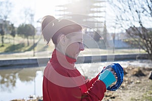 Portrait of mature runner woman with sport headband in the park