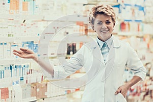 Portrait of Mature Smiling Pharmacist in Drugstore