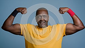 Portrait mature sports african man posing in studio gray background strong muscular athletic male athlete sportsman