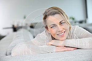 Portrait of mature woamn relaxing on sofa