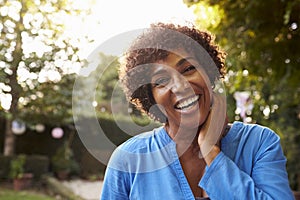 Portrait Of Mature Woman In Back Yard Garden