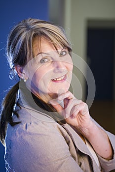 Portrait of mature woman on blue